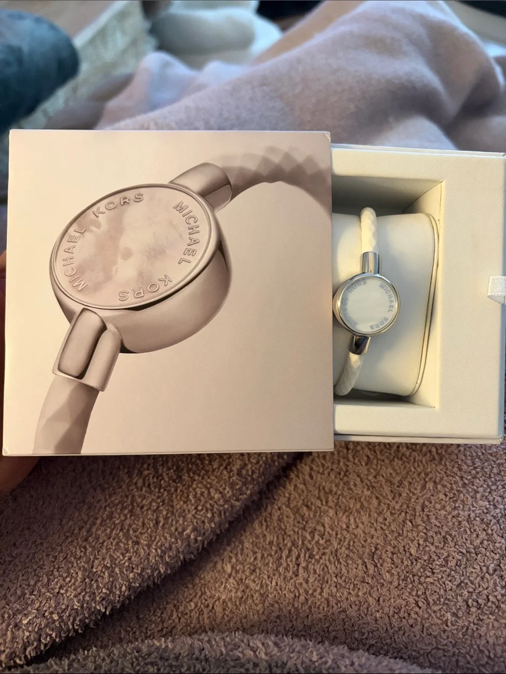 Michael Kors white braided activity tracker with silver-tone case